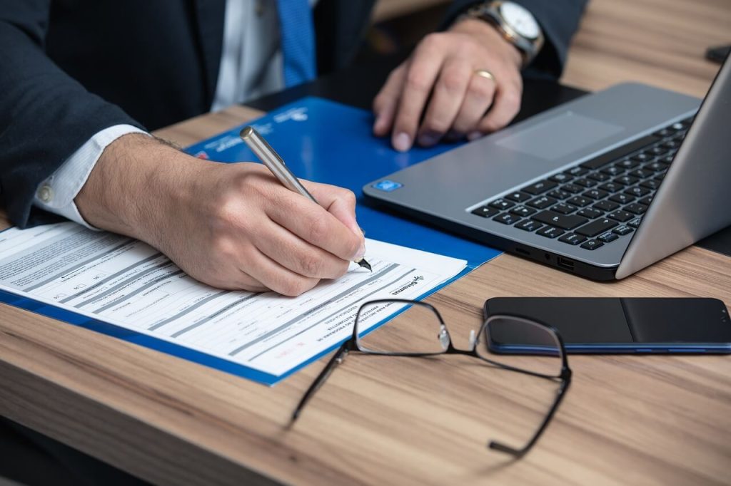 a person writing an official document